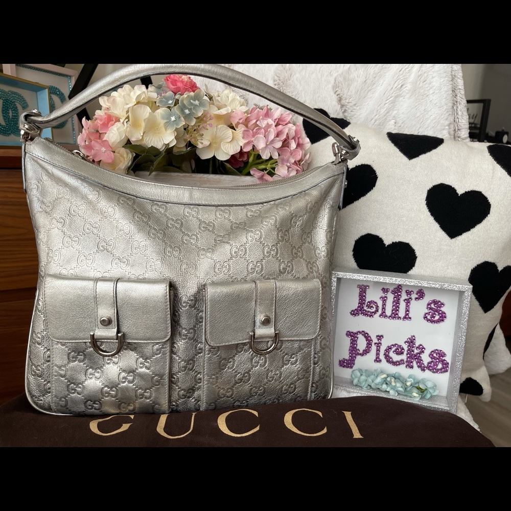 Very Soft leather not hard on the bottom Sliver pre love Gucci shoulder bag.